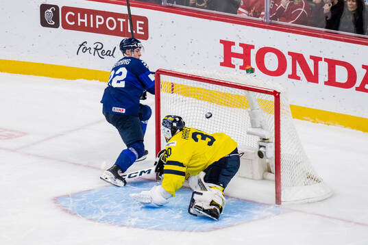 Emil Hemming of Finland and goaltender Love Härenstam of