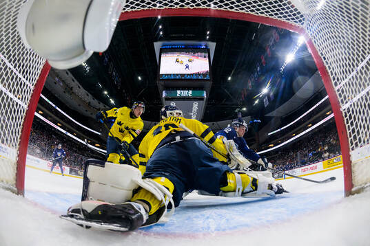 William Håkansson and goaltender Love Härenstam of Sweden