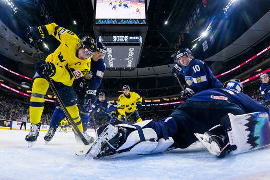 Jack Berglund of Sweden challenges Daniel Nieminen, Roope