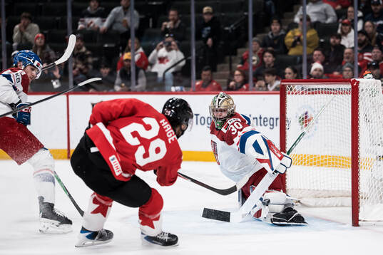 Michael Hage of Canada and goaltender Michal Orsulak of