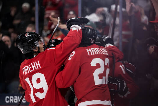 Zayne Parekh, Porter Martone and Tij Iginla of Canada