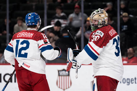 Maxmilian Curran and goaltender Michal Orsulak of Czech
