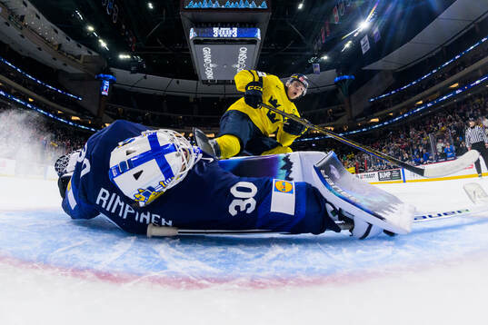 Goaltender Petteri Rimpinen of Finland saves a shot from