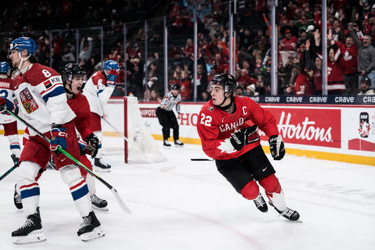 Michael Misa and Porter Martone of Canada celebrates