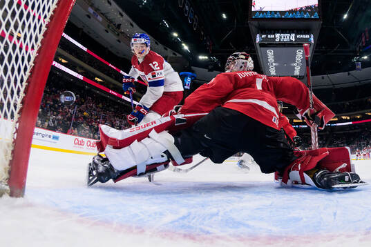 Maxmilian Curran of Czech Republic challenges goaltender