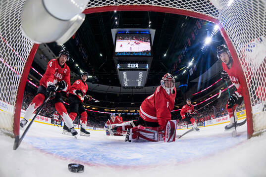 Goaltender Jack Ivankovic of Canada lets in the 4-5 goal by