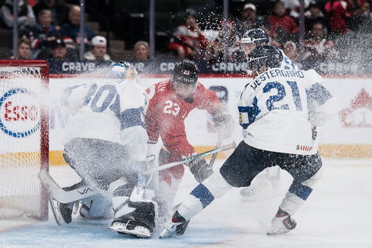 Goaltender Petteri Rimpinen of Finland and Sam O'Reilly of