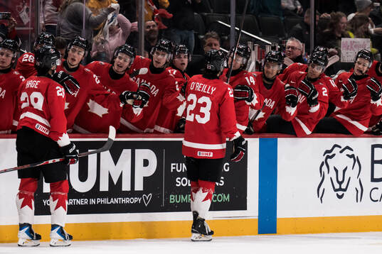 Michael Hage and Sam O'Reilly of Canada celebrates