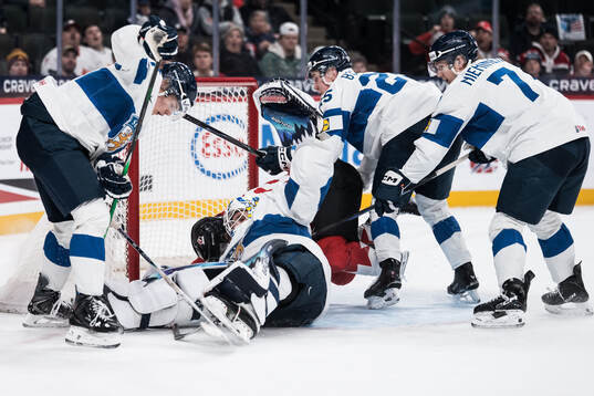 Goaltender Petteri Rimpinen of Finland makes a save