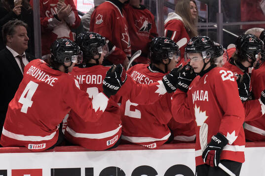 Porter Martone of Canada celebrates