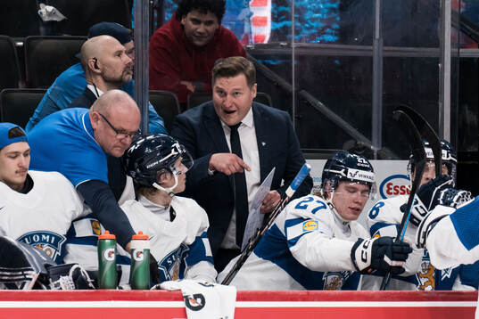 Aatos Koivu and Head coach Lauri Mikkola of Finland
