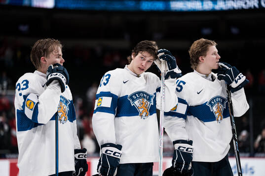 Aron Kiviharju, Leo Tuuva and Aatos Koivu of Finland looks