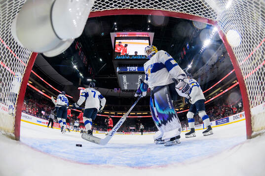 Goaltender Petteri Rimpinen of Finland looks dejected