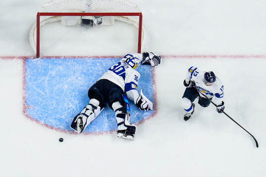 Goaltender Petteri Rimpinen and Veeti Väisänen of Finland