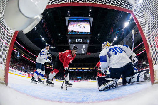 Goaltender Petteri Rimpinen of Finland lets in the 3-2 goal
