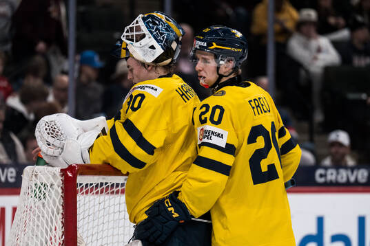 Goaltender Love Härenstam and Alfons Freij of Sweden