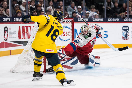 Victor Eklund of Sweden scores the 2-0 goal behind