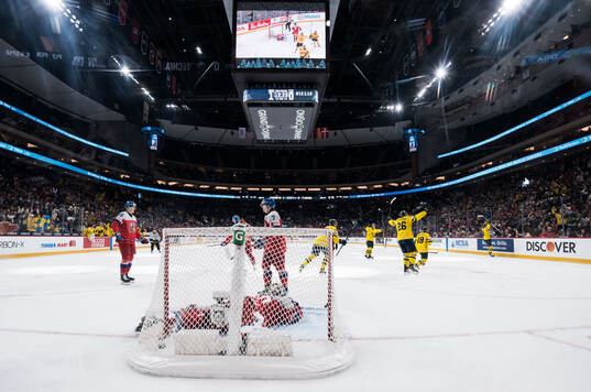 Victor Eklund of Sweden celebrates with teammates