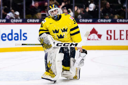 Goaltender Love Härenstam of Sweden looks dejected