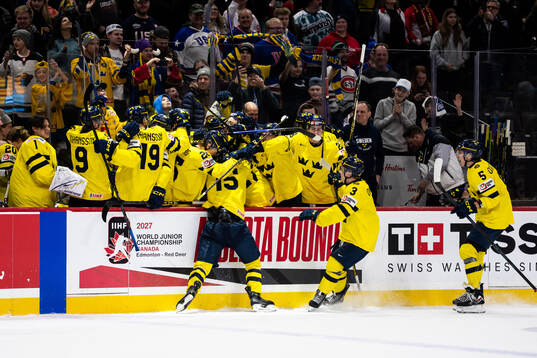Players of Sweden celebrate