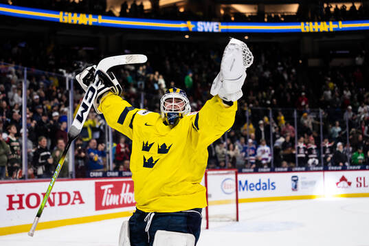 Goaltender Love Härenstam of Sweden celebrates