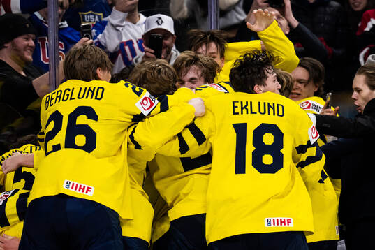 Jack Berglund and Victor Eklund of Sweden celebrate with