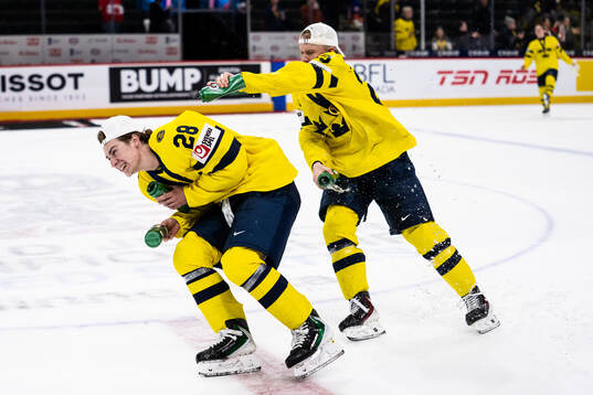 Eric Nilson and Liam Danielsson of Sweden celebrate