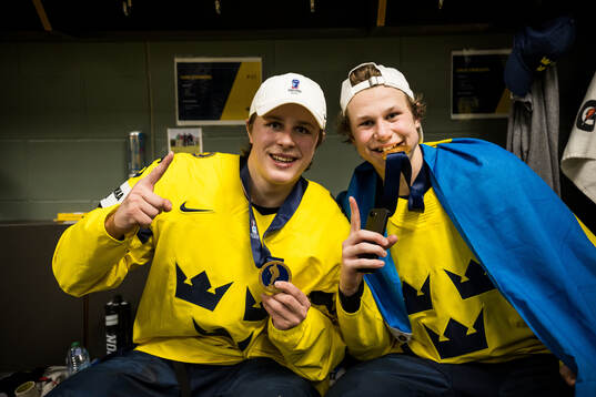 Ivar Stenberg and Eddie Genborg of Sweden celebrate
