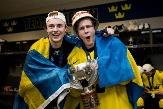 Goaltender Love Härenstam and Ivar Stenberg of Sweden