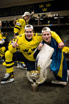Anton Frondell and goaltender Love Härenstam of Sweden