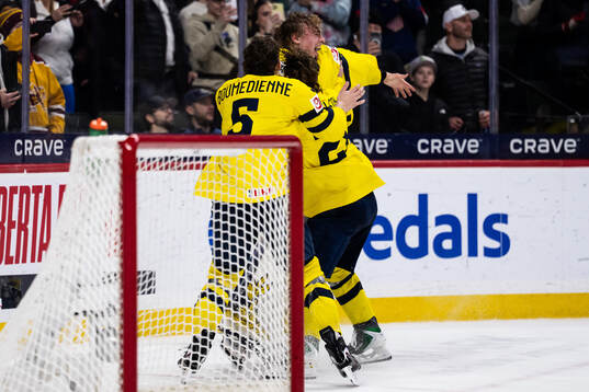 Sascha Boumedienne, Eric Nilson and goaltender Love