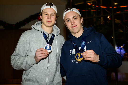 Eddie Genborg and Linus Eriksson of Sweden pose for a photo