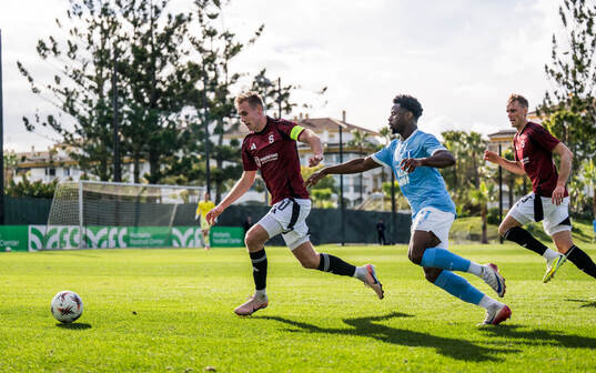 Sivert Mannsverk of Sparta Prag and Emmanuel Ekong of