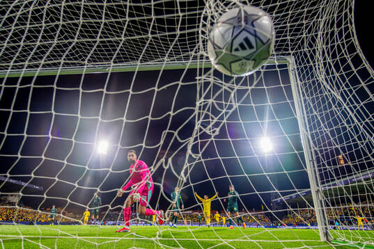 Goalkeeper Gianluigi Donnarumma of Manchester City lets in