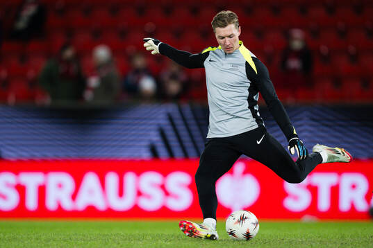 Goalkeeper Mathias Dyngeland of Brann warms up