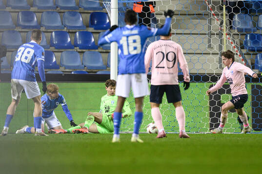 goalkeeper Melker Ellborg and Johan Karlsson of Malmö FF