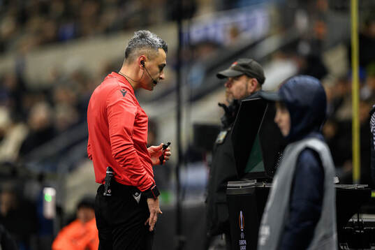 Referee Horatiu Fesnic with a var review