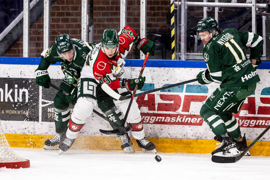 Färjestads Per Åslund och Frölundas Nicklas Lasu och