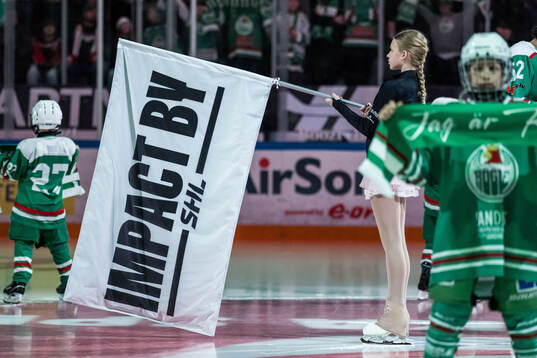 Flagga med texten Impact by SHL