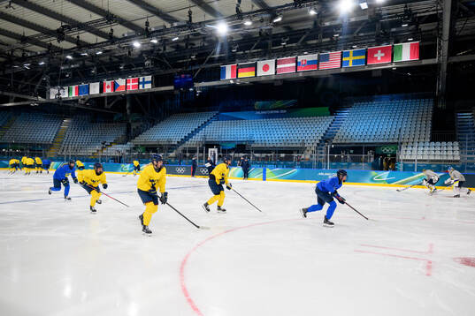 Players of Sweden at a ice hockey practice session