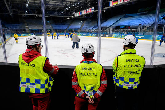 Emergency medical service personal at a ice hockey practice