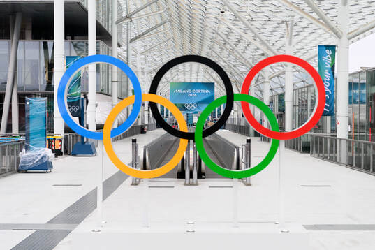 The Olympic rings and branding at the Fiera Milano