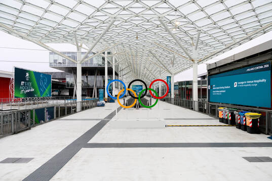 The Olympic rings and branding at the Fiera Milano