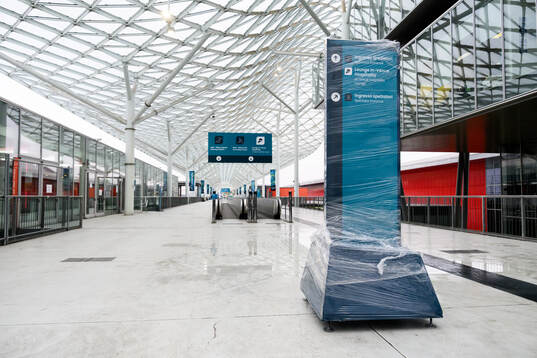 Signs in plastic packaging are seen at Fiera Milano