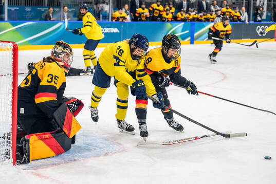 Hanna Olsson of Sweden against goaltender Sandra Abstreiter