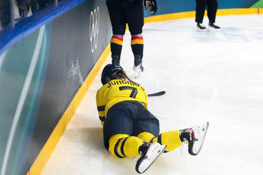 Mira Jungåker of Sweden in pain in the women's ice hockey