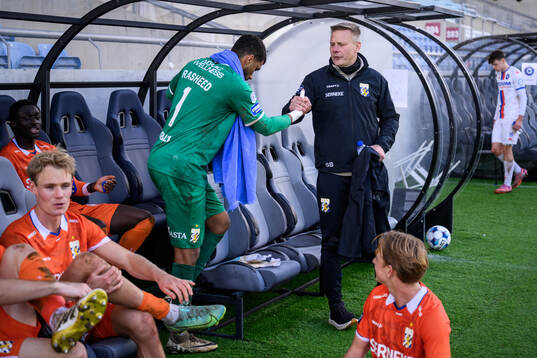 goalkeeper Jonathan Rasheed and coach Stefan Billborn of