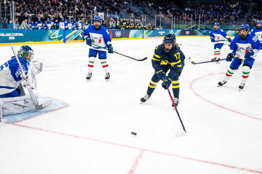Goaltender Martina Fedel of Italy and Sofie Lundin of