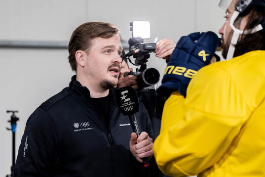 Theo Bylund of HBO Max conducts an interview at an ice
