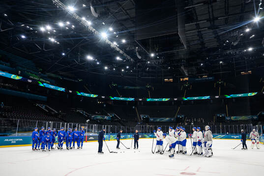 Players of USA in Milano Santagiulia Ice Hockey Arena at an